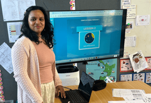 Teacher Jotishna in front of her computer presenting Code Avengers